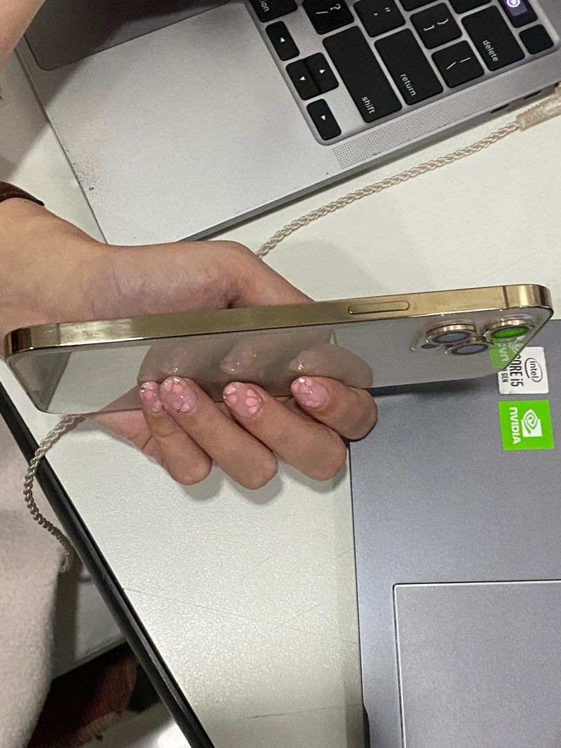 iPhone 12 Pro Max Gold 128GB (Category: iPhone 12 Series) located in Manila. Submitted by missmadame (Listing ID 1395610009, Image 3). Description: Unlocked, ready to use No operational defects Smooth, minor cosmetic flaws (see pictures) ORIG Batt Health 76% pero super kunat pa rin trust No history of repair/replacement Inclusions: Box, Magnetic Phone case + 3 Fashion Cases, Lightning Cable, Wired earphones.