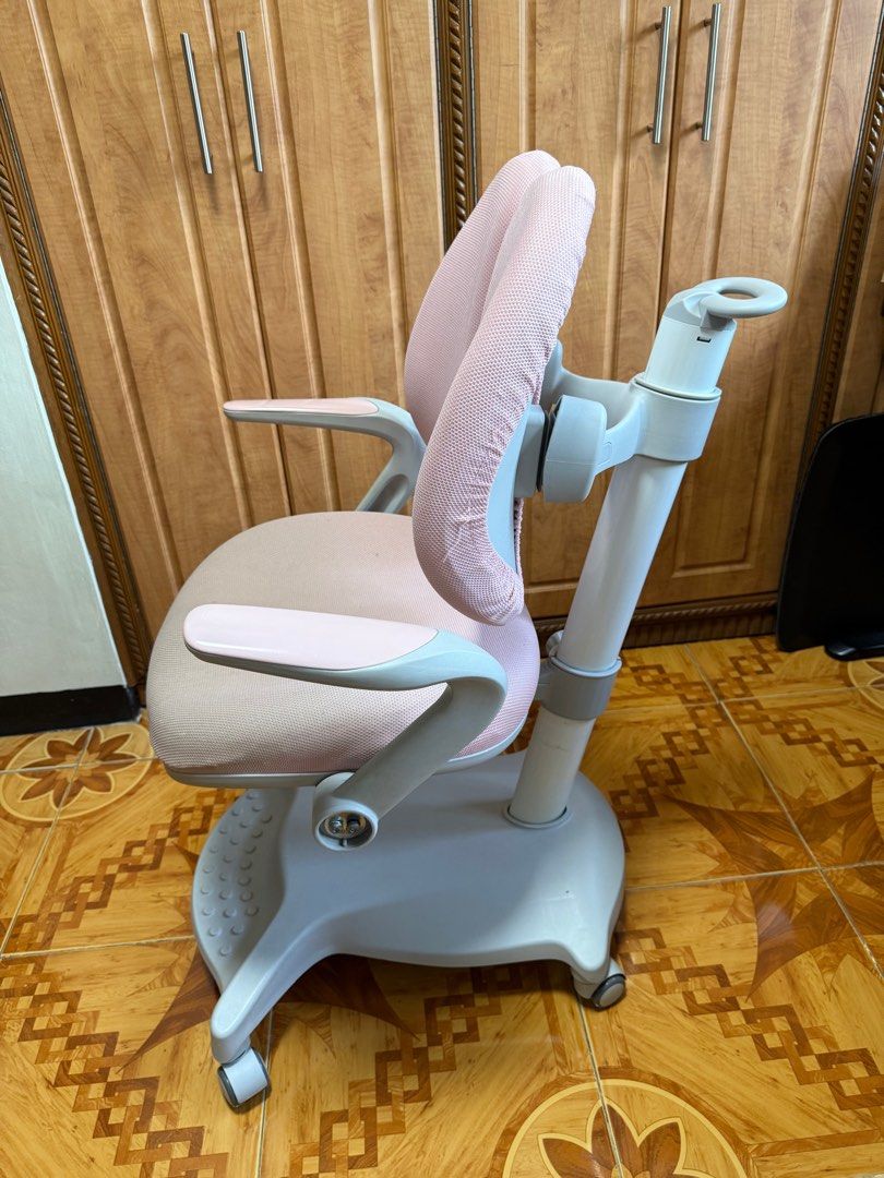 Kid’s Ergo Chair (Category: Office Furniture & Fixtures) located in Calamba. Submitted by sofiesmerch (Listing ID 1395567503, Image 3). Description: Well used but in good condition. Issues: stain on the seat, adjustment needs lubrication, missing side cover. Can provide seat cover, orig price 13k.