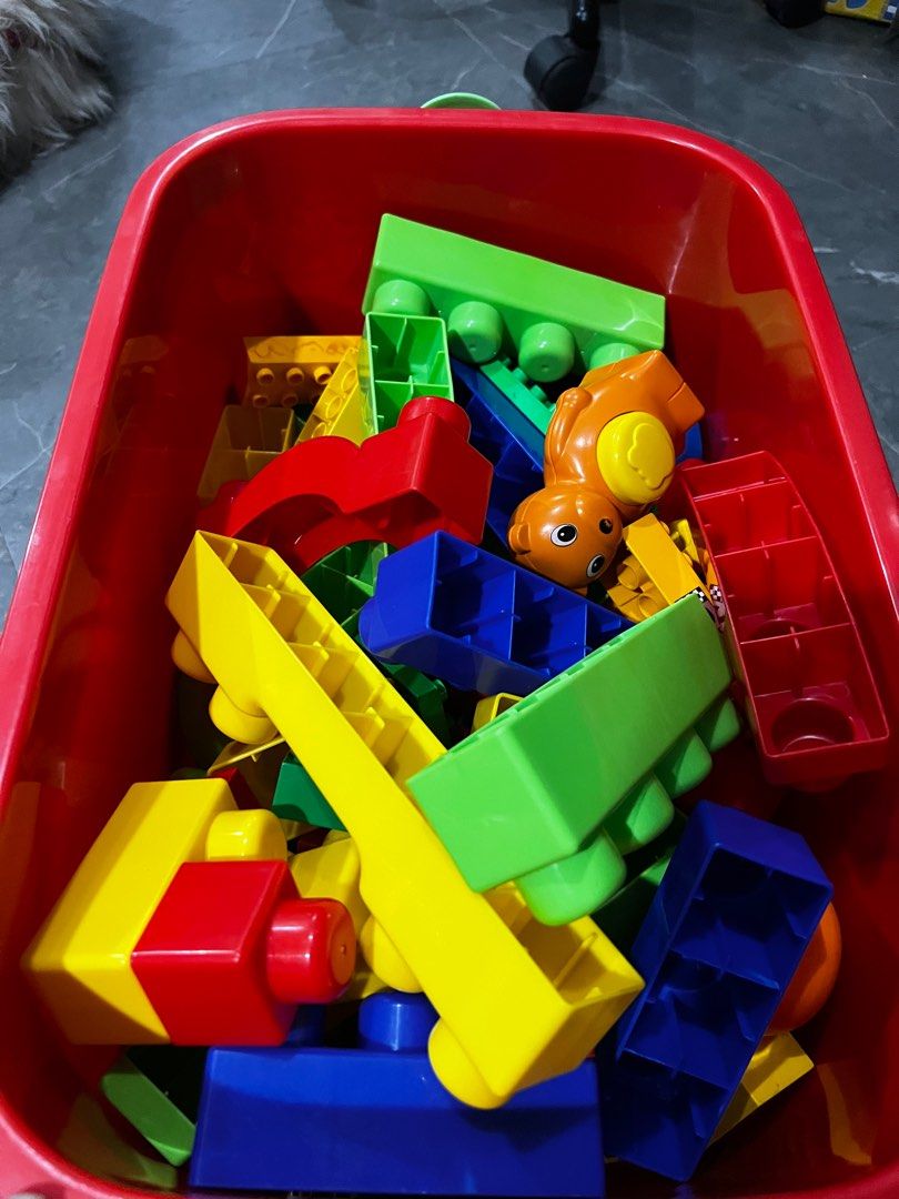 Duplo Large Building Blocks with Storage Box (Category: Lego & Building Sets) located in Quezon City. Submitted by daday39 (Listing ID 1395685827, Image 3). Description: As is po ako dito - Colorful large building blocks - Various shapes and sizes - Includes long rectangular blocks and blocks with rounded edges - Comes with a storage box - Storage box has a red base and yellow lid - Storage box has a handle for easy carrying.