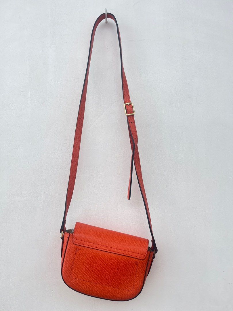 Longchamp EPURE Shoulder Bag Orange (Category: Luxury Bags & Wallets) located in Dasmarinas. Submitted by bandananowheree (Listing ID 1395594319, Image 3). Description: This mini crossbody bag is both youthful and feminine in its allure. Fastened with a snap closure, it features an adjustable strap and saddlery silhouette, giving a nod to LONGCHAMP’s equestrian heritage. In durable Russian leather, Épure goes beyond a statement piece by turning c