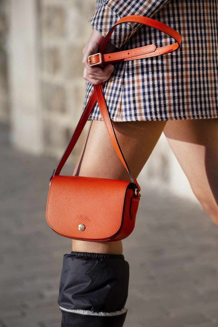 Longchamp EPURE Shoulder Bag Orange (Category: Luxury Bags & Wallets) located in Dasmarinas. Submitted by bandananowheree (Listing ID 1395594319, Image 2). Description: This mini crossbody bag is both youthful and feminine in its allure. Fastened with a snap closure, it features an adjustable strap and saddlery silhouette, giving a nod to LONGCHAMP’s equestrian heritage. In durable Russian leather, Épure goes beyond a statement piece by turning c