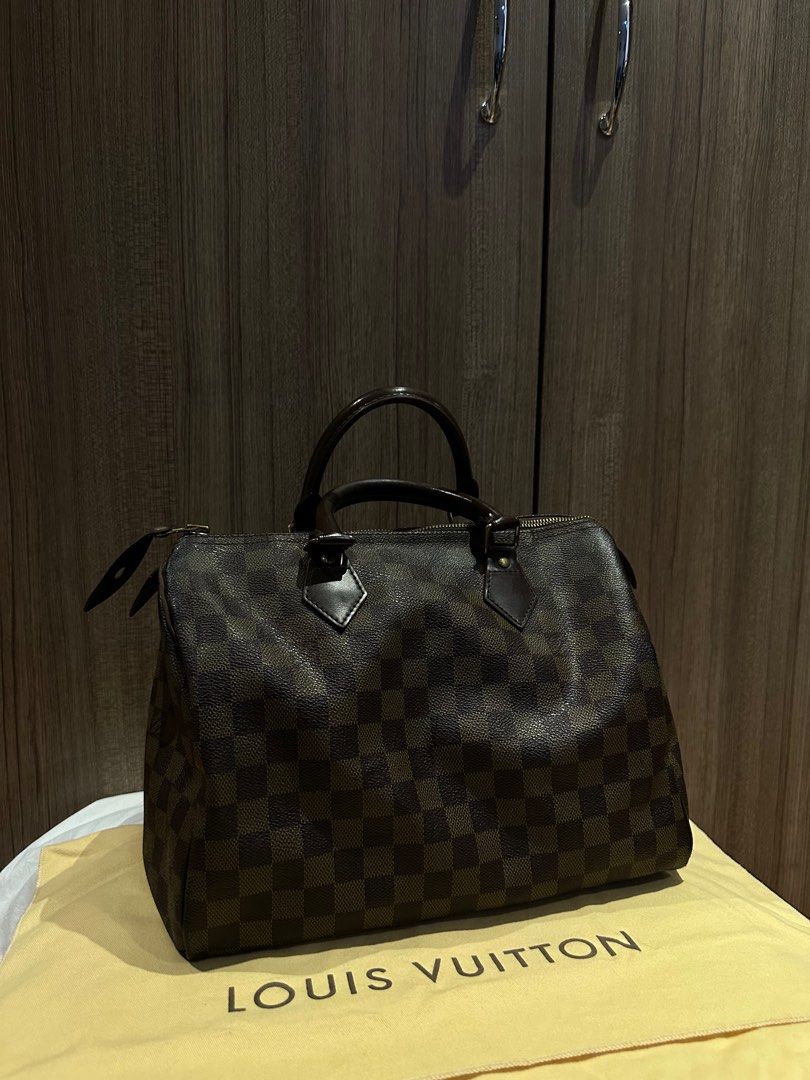 Louis Vitton Speedy (Category: Luxury Bags & Wallets) located in Quezon City. Submitted by mzrc1 (Listing ID 1395675371, Image 1). Description: Speedy LV Customized RFS not being used anymore Check last photo for stamp on bag Inclusions: Bag Price is negotiable Location: QC .