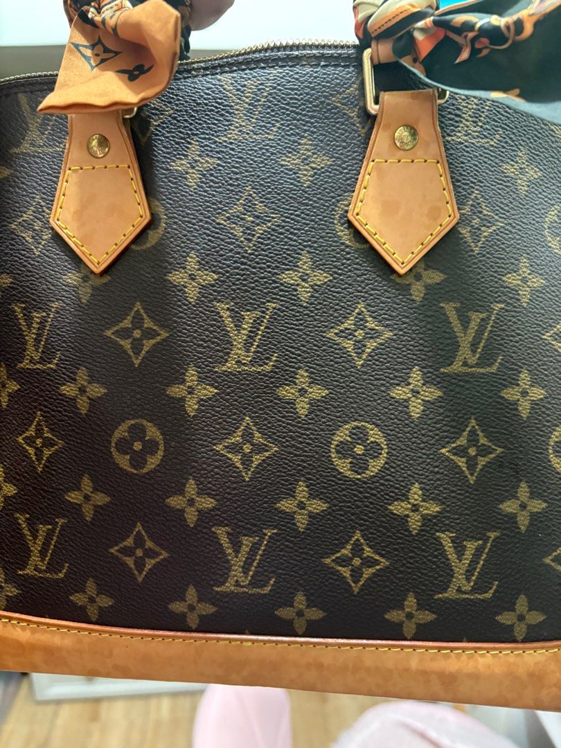 Louis Vuitton Alma handbag (Category: Luxury Bags & Wallets) located in Cainta. Submitted by ricaching (Listing ID 1395705548, Image 2). Description: 100 % authentic LV bag, with just minor stains but all in all in very good condition. Comes with lock and key..