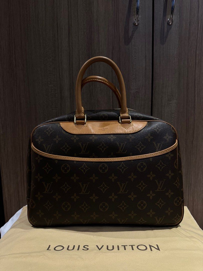 Louis Vuitton Deauville (Category: Luxury Bags & Wallets) located in Quezon City. Submitted by mzrc1 (Listing ID 1395675372, Image 1). Description: Authentic Louis Vuitton Deauville handbag. Features the iconic LV monogram canvas, with a zip closure and leather handles. The bag has a structured shape and a spacious interior. Includes the original dust bag. A classic and stylish piece. RFS not being used anymore Check last photo for stain Inclusio