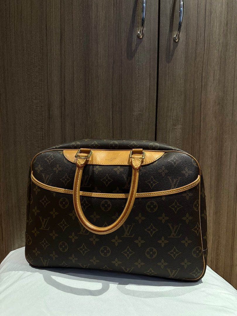 Louis Vuitton Deauville (Category: Luxury Bags & Wallets) located in Quezon City. Submitted by mzrc1 (Listing ID 1395675372, Image 3). Description: Authentic Louis Vuitton Deauville handbag. Features the iconic LV monogram canvas, with a zip closure and leather handles. The bag has a structured shape and a spacious interior. Includes the original dust bag. A classic and stylish piece. RFS not being used anymore Check last photo for stain Inclusio