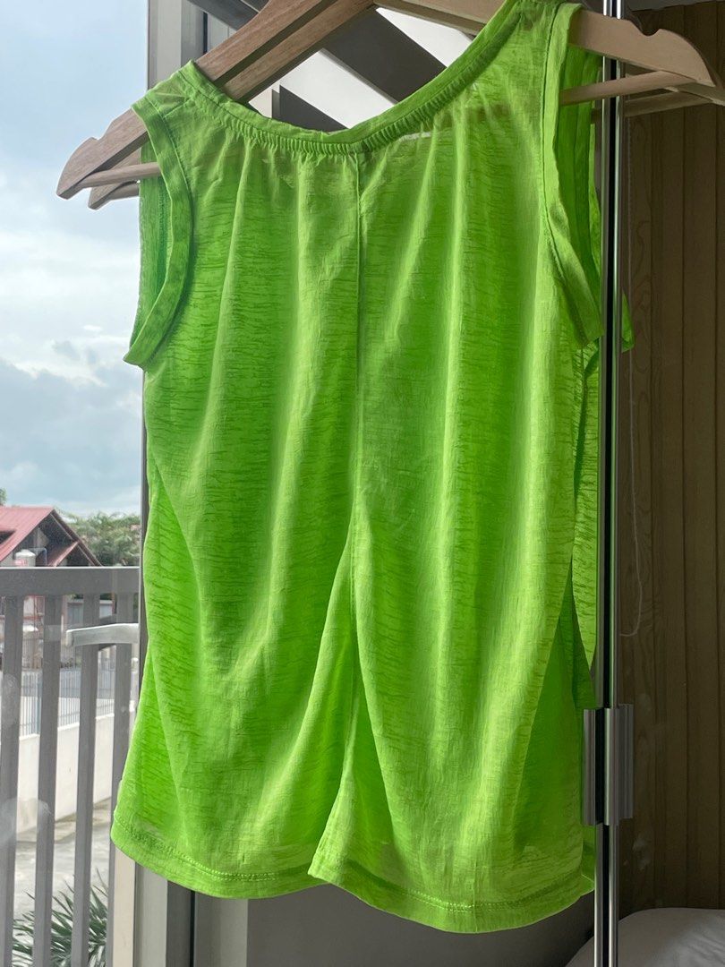 Neon Green Tank Top - Size M (Category: Sleeveless) located in Las Pinas. Submitted by serialthrifter (Listing ID 1395567392, Image 2). Description: - Neon green tank top - Size: S-M - Features: Scoop neck, split back - Fabric: Lightweight, possibly sheer - Versatile for layering.