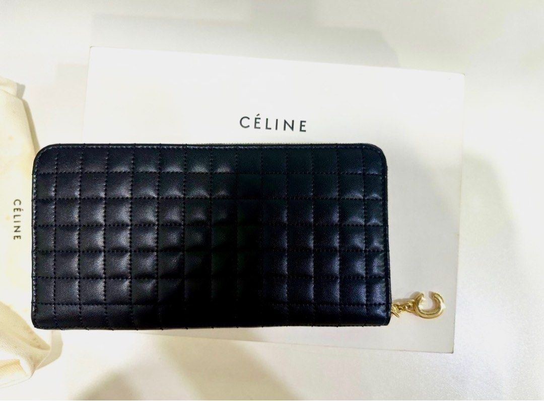Celine Quilted Leather Zip Around Wallet (Category: Luxury Bags & Wallets) located in Quezon City. Submitted by 18john (Listing ID 1395636207, Image 3). Description: - near New Authentic Celine Calf Skin wallet - Black quilted leather - Gold-tone zipper and charm - Includes original box - sign of storage - Includes dust bag - sign of storage .