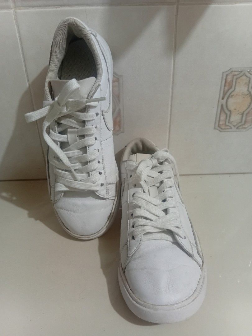 Nike Blazer Low White Sneakers 6.5 (Category: Sneakers) located in Binan City. Submitted by preloved55.com (Listing ID 1395644252, Image 1). Description: - White Nike Blazer Low sneakers - Low-top design - White leather upper - Classic Nike swoosh - White laces - Rubber sole - Visible wear on soles and uppers - Some wear on insoles Us 6.5 on tag some creases pls see pics for actual shoes needs laba shipping lbc cop gcash payment returns not accep