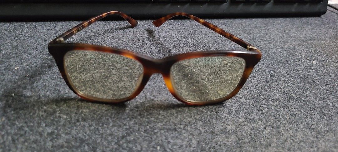 Original Gucci Eyeglasses blue light (Category: Sunglasses & Eyewear) located in Cebu City. Submitted by AUDIOWOLF (Listing ID 1395569584, Image 3). Description: - Authentic Gucci eyeglasses - Brown tortoise frame with gold accents - Model: GG1050O - Originally priced at ₱9000.00 .