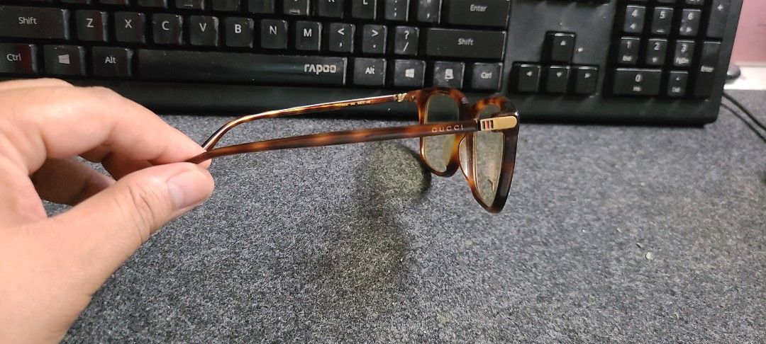 Original Gucci Eyeglasses blue light (Category: Sunglasses & Eyewear) located in Cebu City. Submitted by AUDIOWOLF (Listing ID 1395569584, Image 2). Description: - Authentic Gucci eyeglasses - Brown tortoise frame with gold accents - Model: GG1050O - Originally priced at ₱9000.00 .