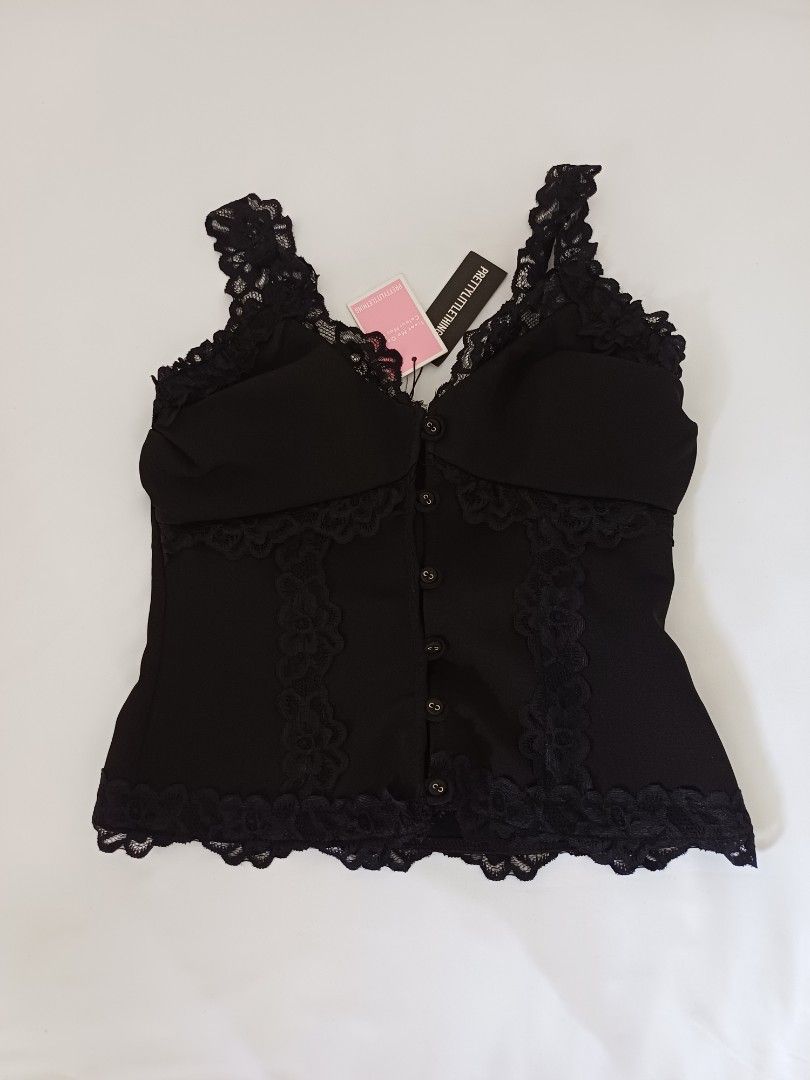 PrettyLittleThing Black Lace Trim Top (Category: Sleeveless) located in Angeles City. Submitted by dianern (Listing ID 1395570470, Image 1). Description: - PrettyLittleThing black top - Lace trim detail - Hook-and-eye closure - Fitted design - Solid black color - Brand new with tag.