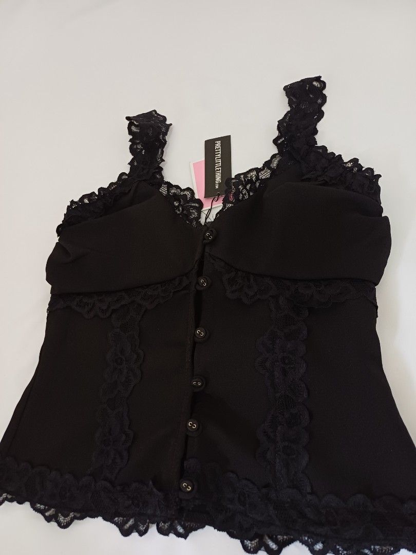 PrettyLittleThing Black Lace Trim Top (Category: Sleeveless) located in Angeles City. Submitted by dianern (Listing ID 1395570470, Image 3). Description: - PrettyLittleThing black top - Lace trim detail - Hook-and-eye closure - Fitted design - Solid black color - Brand new with tag.