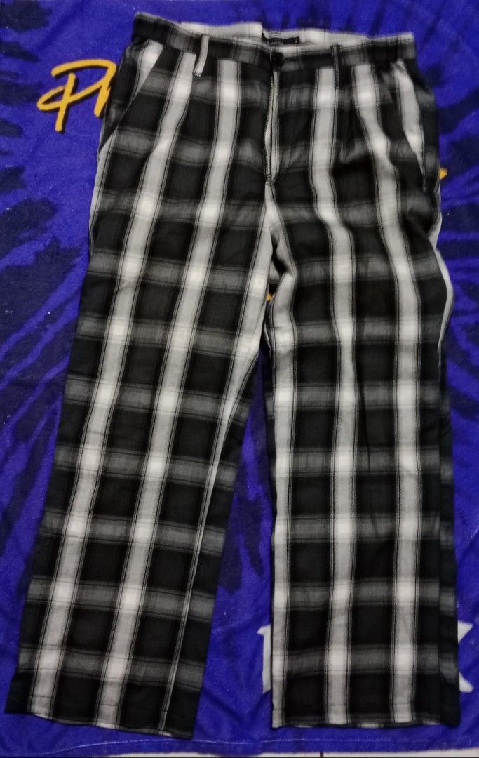 RAGEBLUE Plaid Pants - Size M (Category: Jeans) located in Silang. Submitted by densrodrig08604 (Listing ID 1395599860, Image 1). Description: Stylish plaid pants from RAGEBLUE. Features a classic black and white checkered pattern. The pants have a button closure and a comfortable fit. Size M. Measurements are 32-34 x 39 x 10. Perfect for a casual yet fashionable look. Great for everyday wear. excellent condi,as new condi no issue, needwash payme