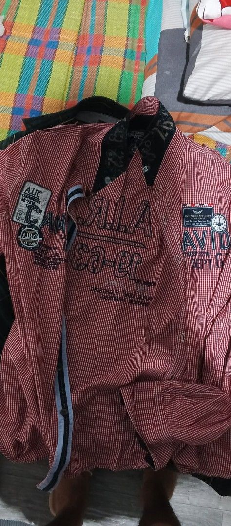 Red and White Striped Shirt (Category: Coats, Jackets and Outerwear) located in Naga. Submitted by r4e_3ftz (Listing ID 1395678154, Image 1). Description: Medium but can fit as large Still new - Red and white striped shirt - Black collar and patches - Features "A.I.R. Ea-er" text - Button-down closure - Long sleeves - Unique nautical-themed collar design - Black and white stripe down the front.