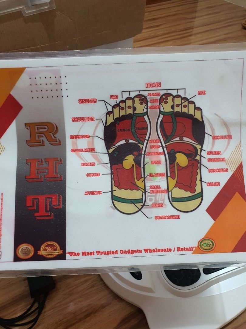 RHT TENS Therapy Foot Massager (Category: Massage Devices) located in Cavite. Submitted by heyimsosab (Listing ID 1395621379, Image 2). Description: - RHT TENS Therapy Foot Massager - Includes: Belt, Pads, Remote Control, and Instruction Manual - Features foot-shaped platforms with red accents - Provides TENS therapy - Includes diagrams of body and foot reflexology points originally nabili nasa 35k rfs: decluttering po very effective for tense mu