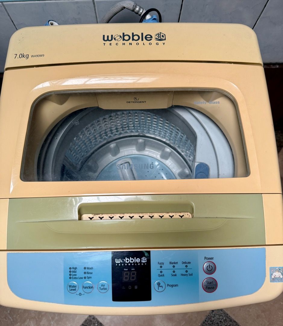 Samsung Wobble 7kg top load automatic washing machine (Category: Washing Machines and Dryers) located in Taguig. Submitted by denniscu (Listing ID 1395651497, Image 2). Description: Top load Automatic 7kg Working condition Minor repairs Pickup or Lalamove to your location.