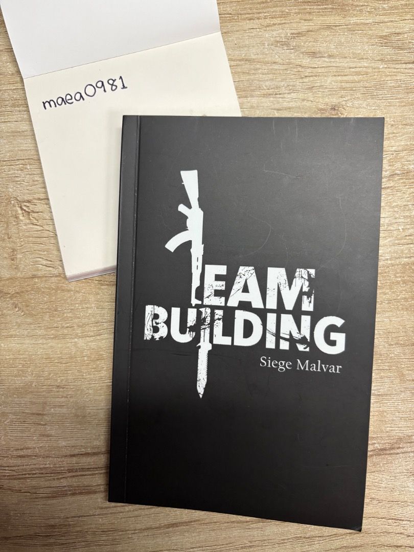 Team Building by Siege Malvar (Category: Storybooks) located in Naga. Submitted by maea0981 (Listing ID 1395637952, Image 1). Description: - "Team Building" by Siege Malvar: perfect for enhancing teamwork. - Includes a humorous anecdote about working together. - Cover: Black with white text and graphics..
