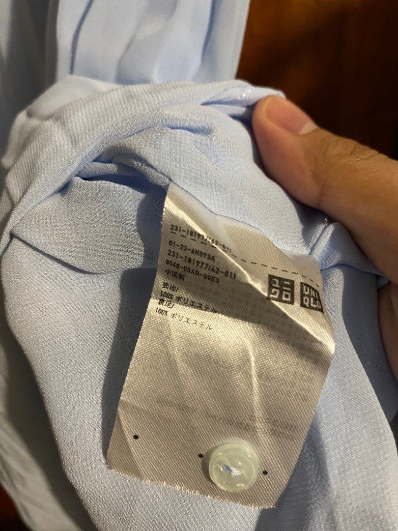 Uniqlo Pleated Top - Light Blue - Size M (Category: Blouses) located in Santa Rosa. Submitted by lesssojuplease (Listing ID 1395636428, Image 2). Description: - Uniqlo pleated top - Color: Light Blue - Size: M - Features: Round neckline, short sleeves - Material: 100% Polyester - Design: Pleated front - Closure: Button at back of neck Ship via J&T 📍Sta. Rosa.