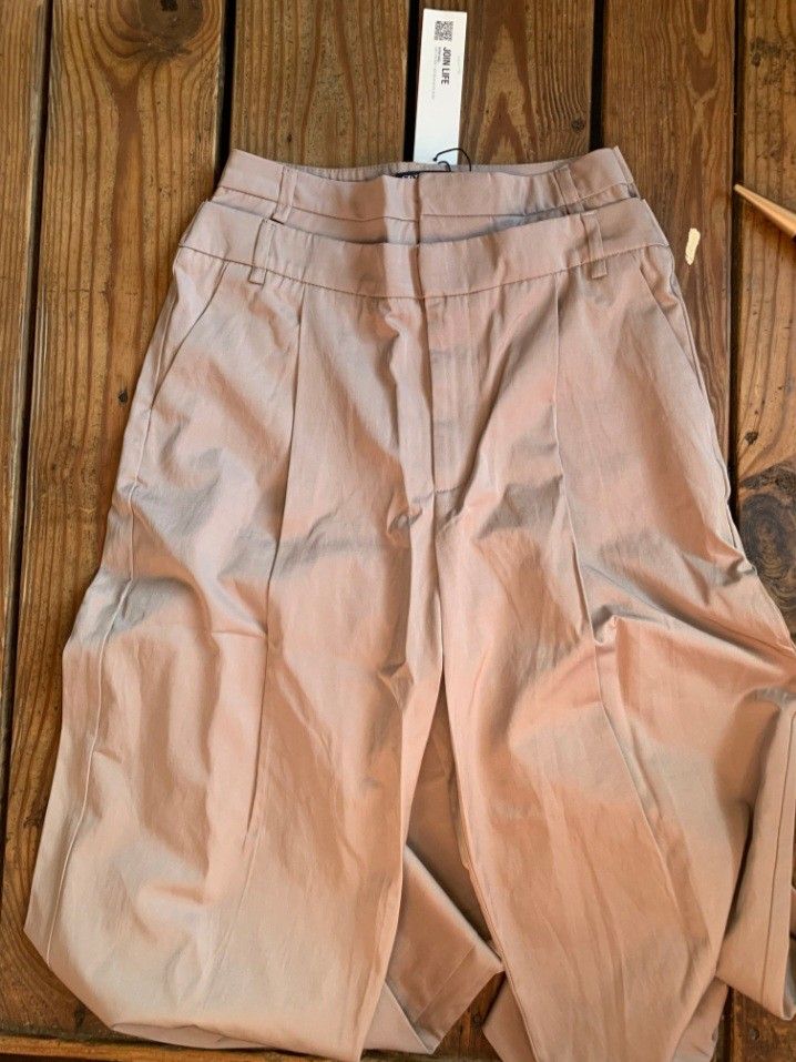 Zara double waistband trousers (Category: Other Bottoms) located in Santa Rosa. Submitted by chaneloberli.n (Listing ID 1395694344, Image 2). Description: - Beige color - Size XS - Relaxed fit - New with tags - Original price: ₱2,995.00 - Button and zipper closure - original seller had it altered -2cm at the waistband but still fits like xs zara (can be easily removed) - never used; too big for me - no ww - slightly negotiable waist: 13 in. lengt