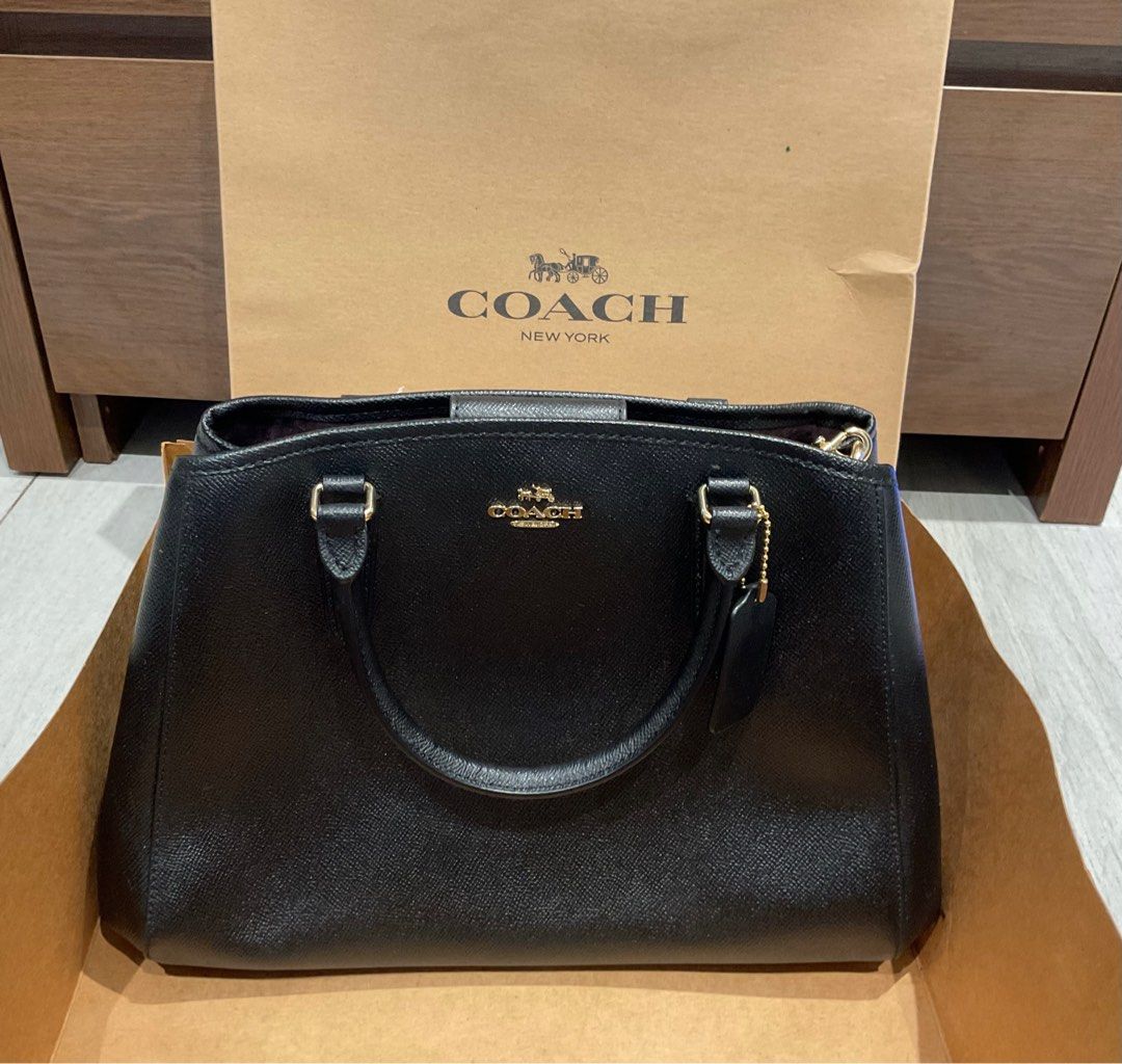 Coach small margot carryall black (Category: Luxury Bags & Wallets) located in Manila. Submitted by induljenceco (Listing ID 1390606359, Image 1). Description: With shoulder strap Please see picture for small damage inside Never used Still with tag.