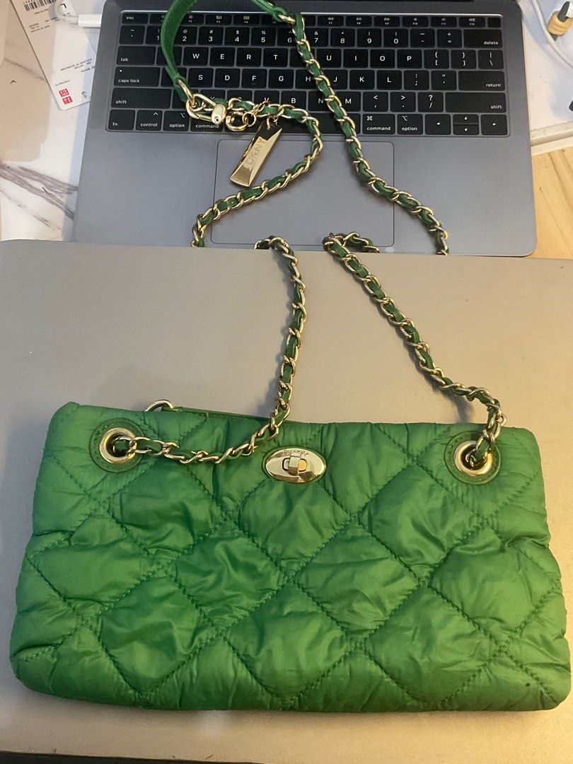 DKNY GREEN CONVERTIBLE CHAIN BAG 💚 (Category: Cross-body Bags) located in Manila. Submitted by nduckling (Listing ID 1390717820, Image 2). Description: DKNY GREEN CROSS BODY/SHOULDER CHAIN BAG 💚 💚Nylon puffy bag 💚 Expect may signs of usage lang wala namang major major bakbak. Super cute ✨ RFS moving out declutter .