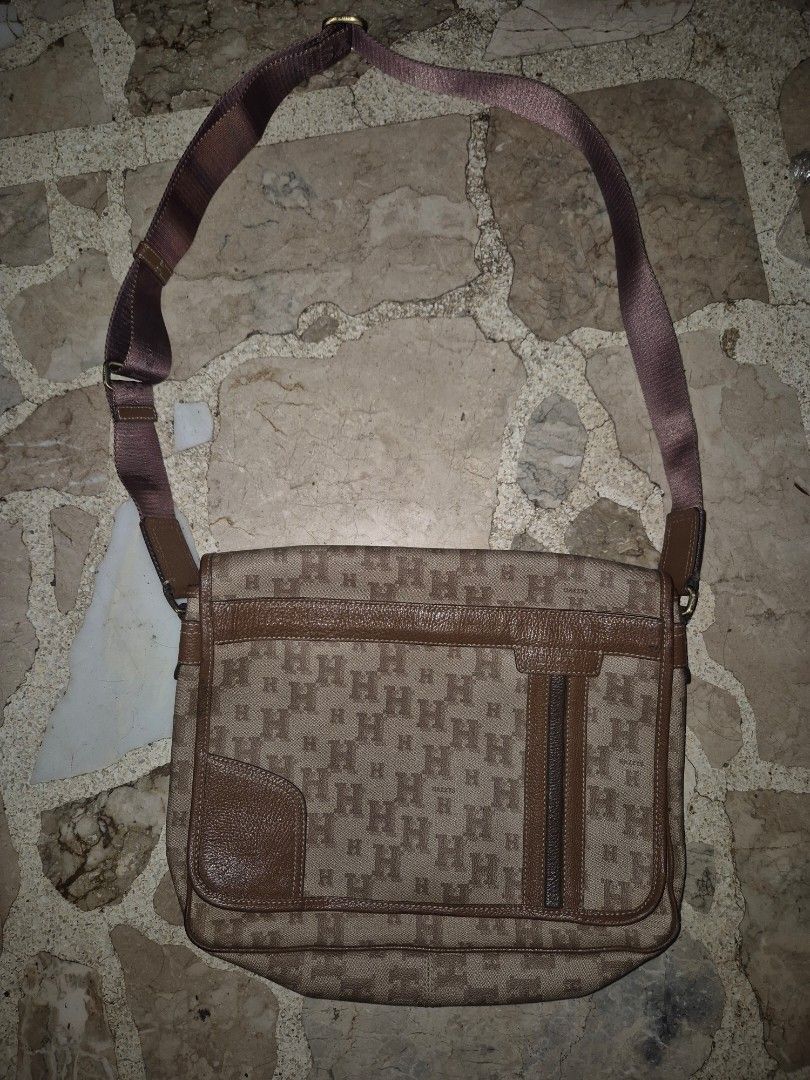 Hazzy mens sling (Category: Luxury Bags & Wallets) located in Quezon City. Submitted by gadgetsandstuffs.qc (Listing ID 1390745602, Image 1). Description: Hazzys mens sling brown leather water repellant combination med size intact rubber lining no crack no chopping with multiple compartment.