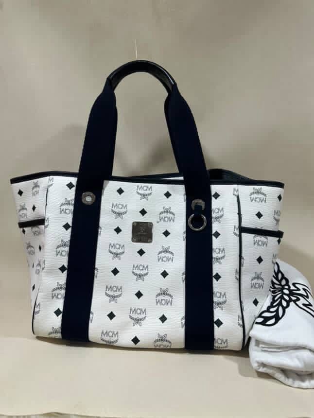 MCM Shoppers Tote Bag (Category: Luxury Bags & Wallets) located in Manila. Submitted by buy.that.bag (Listing ID 1390604356, Image 1). Description: Guaranteed Authentic Comes with dustbag only White body,Blue Handle,Black Trimmings Pls check pics for signs of use MOP: BDO/BPI/Gcash Shipping c/o buyer PIOG.