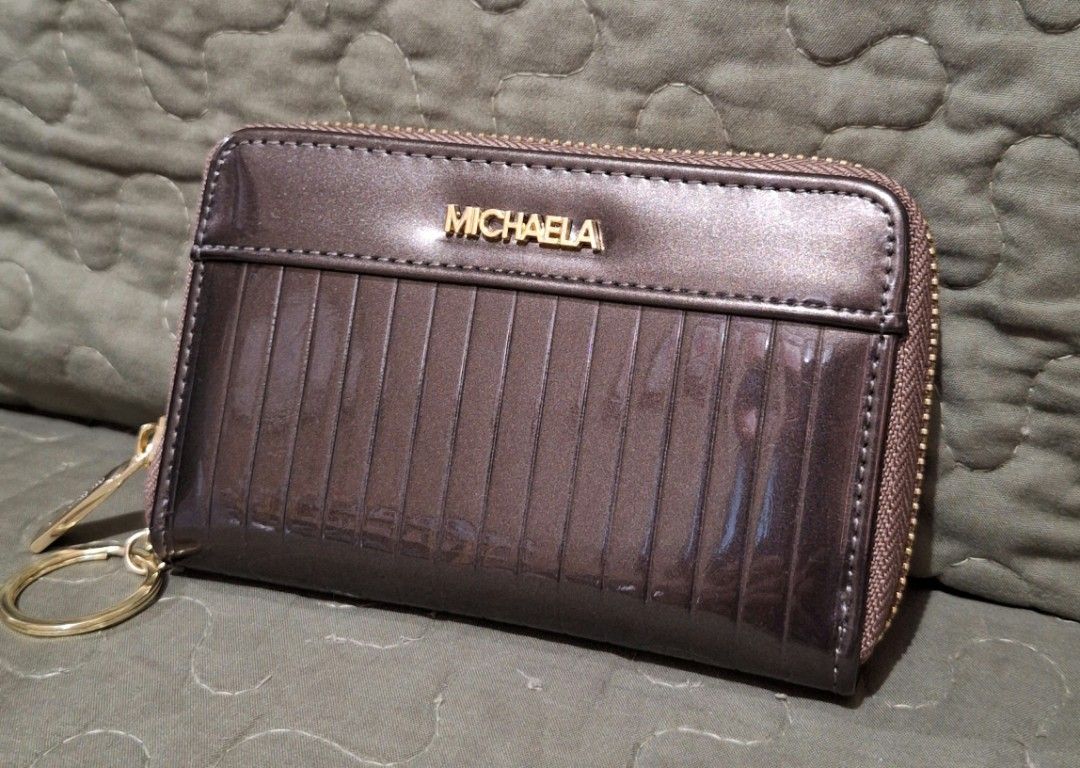 MICHAELA Stripes Embossed Short Wallet with Keyring Glossy (Category: Wallets & Card holders) located in Quezon City. Submitted by prelovedbox2016 (Listing ID 1390662493, Image 1). Description: like new no flaws bought for 500.