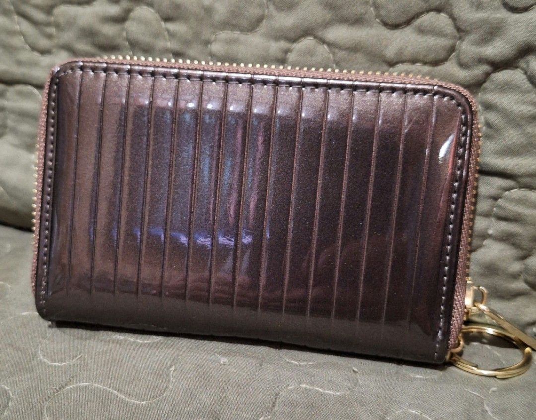 MICHAELA Stripes Embossed Short Wallet with Keyring Glossy (Category: Wallets & Card holders) located in Quezon City. Submitted by prelovedbox2016 (Listing ID 1390662493, Image 2). Description: like new no flaws bought for 500.