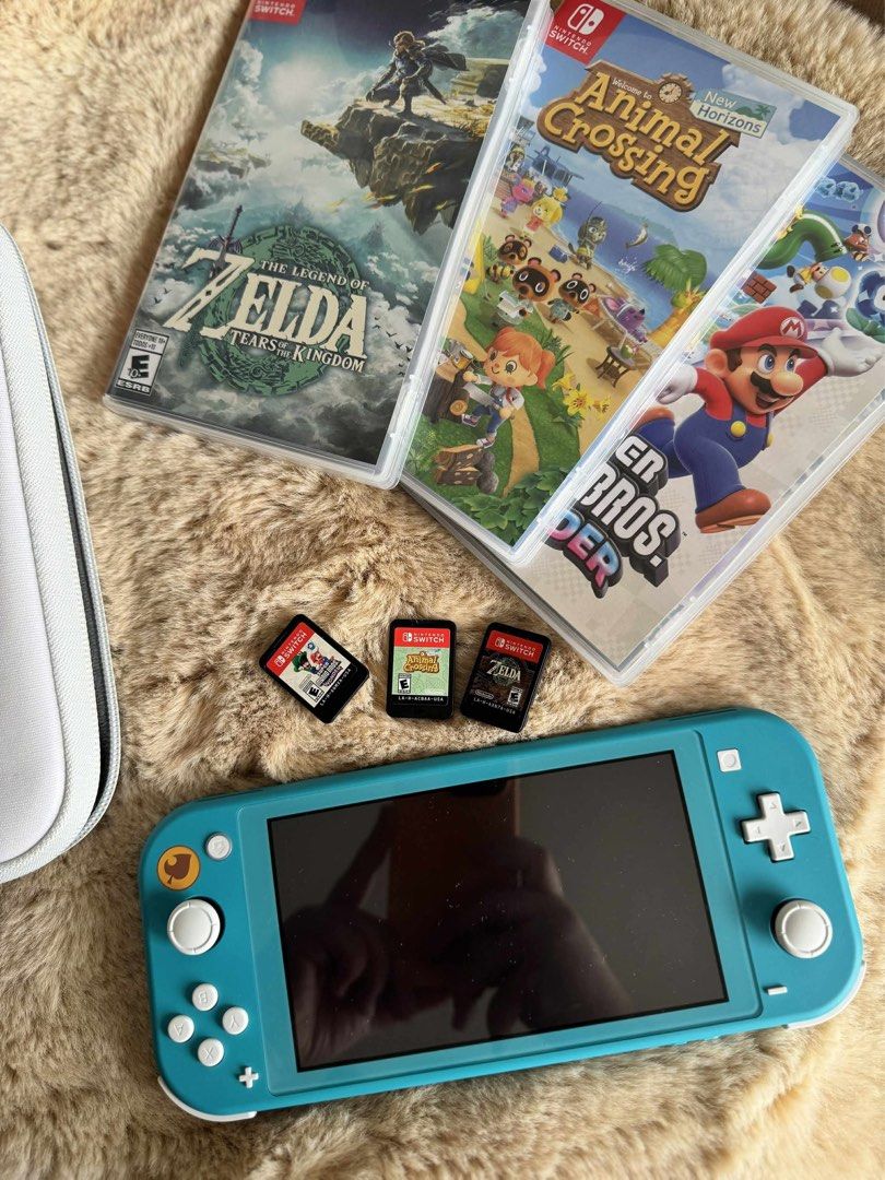 Nintendo Switch Lite – Animal Crossing Edition (Turquoise) (Category: Nintendo) located in Cavite. Submitted by kumbin (Listing ID 1390695002, Image 1). Description: 🎮 Nintendo Switch Lite – Animal Crossing Edition (Turquoise) Purchased Dec 2023 in Singapore, excellent condition, almost never used ✨ Includes 3 popular games: • Zelda: Tears of the Kingdom • Animal Crossing: New Horizons • Super Mario Bros. Wonder ✅ All working perfectly ✅ With ca