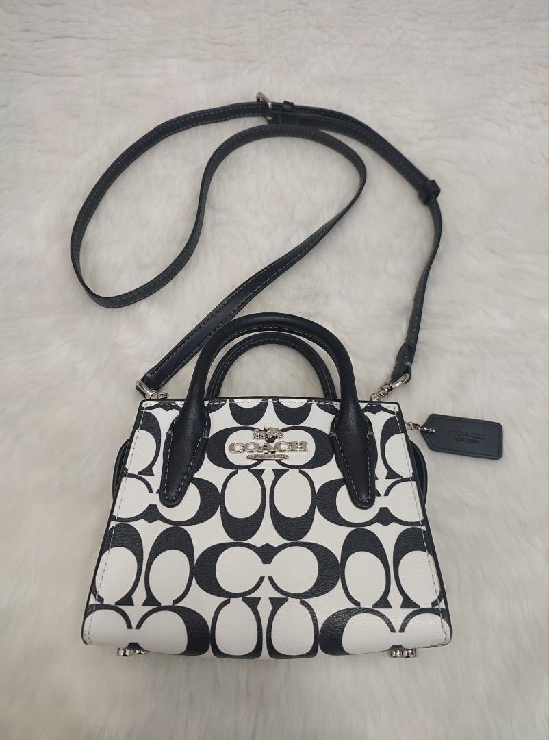 Preloved Authentic Coach Mini Andrea Sling Bag (Category: Luxury Bags & Wallets) located in Bulacan. Submitted by mandjays (Listing ID 1390734720, Image 1). Description: Almost new condition. Please check all pictures posted. Strictly no returning of item. Negotiable!.