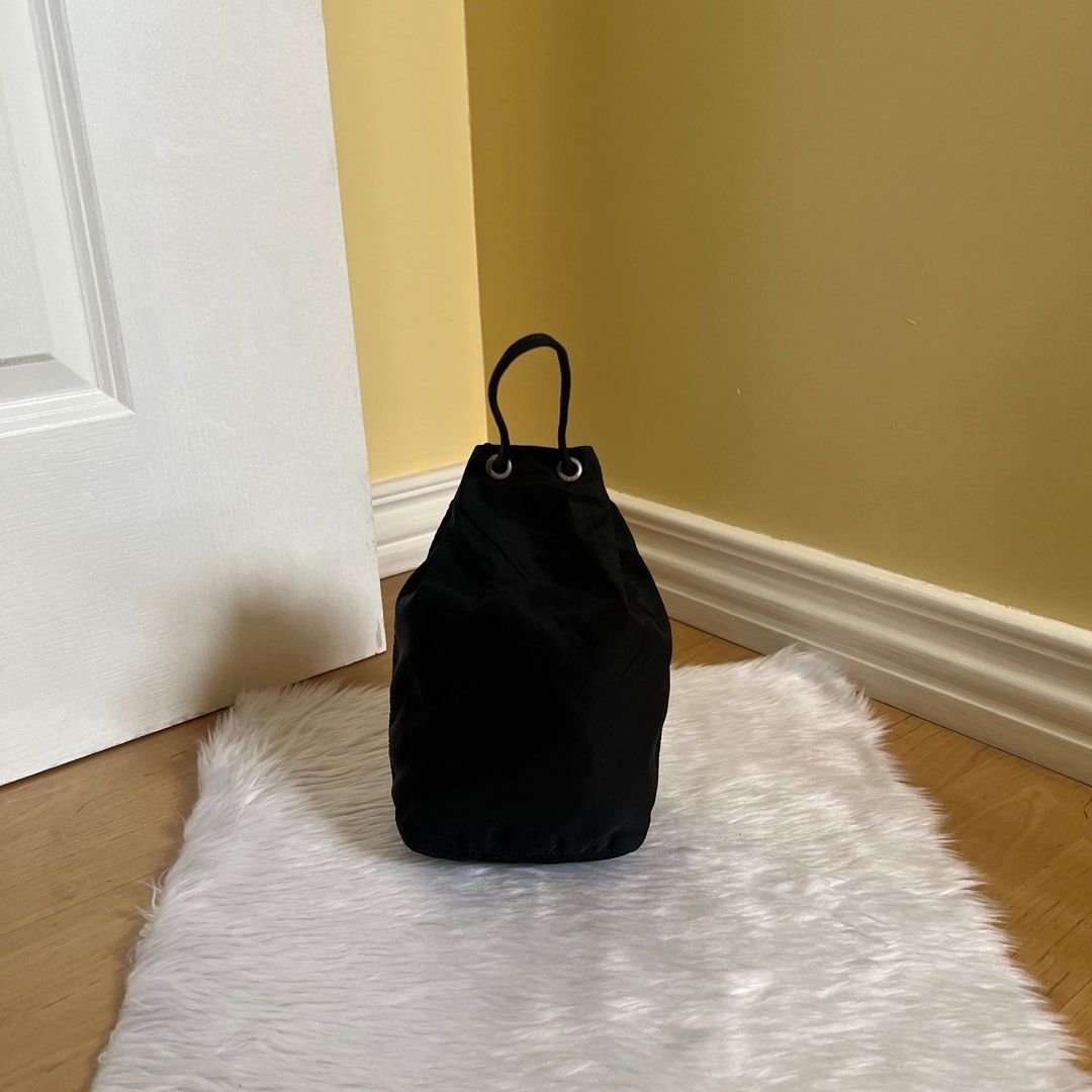 Authentic Preloved Prada Nylon Bucket Bag (Category: Luxury Bags & Wallets) located in Quezon City. Submitted by tokyoluxestuff2013 (Listing ID 1390875796, Image 2). Description: Authentic Preloved Prada Nylon Bucket Black Approx 13cm W x 22 cm H No inclusion Onhand Shipping via LBC/ Grab/ Lalamove Add shipping fee.