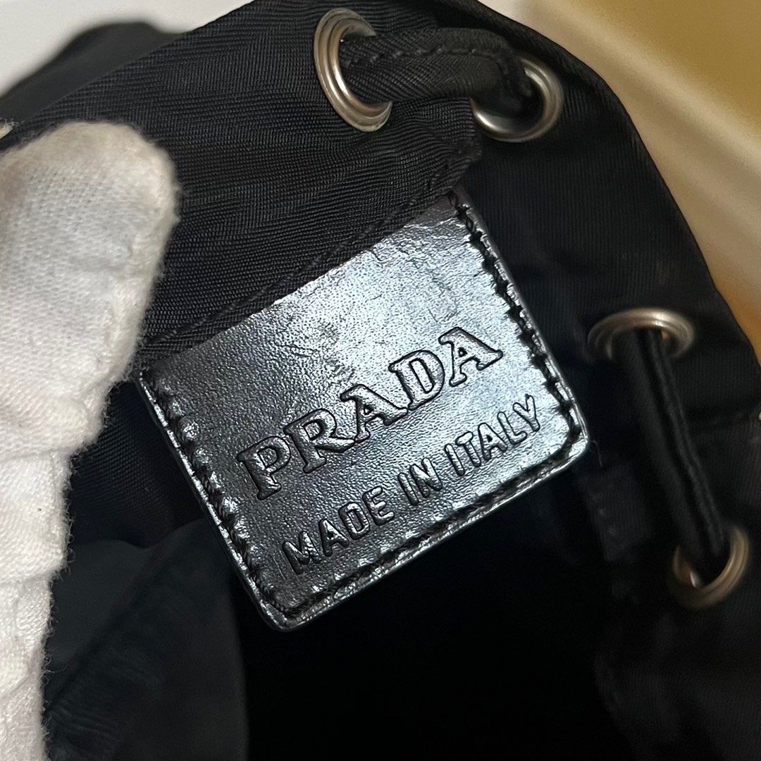 Authentic Preloved Prada Nylon Bucket Bag (Category: Luxury Bags & Wallets) located in Quezon City. Submitted by tokyoluxestuff2013 (Listing ID 1390875796, Image 3). Description: Authentic Preloved Prada Nylon Bucket Black Approx 13cm W x 22 cm H No inclusion Onhand Shipping via LBC/ Grab/ Lalamove Add shipping fee.