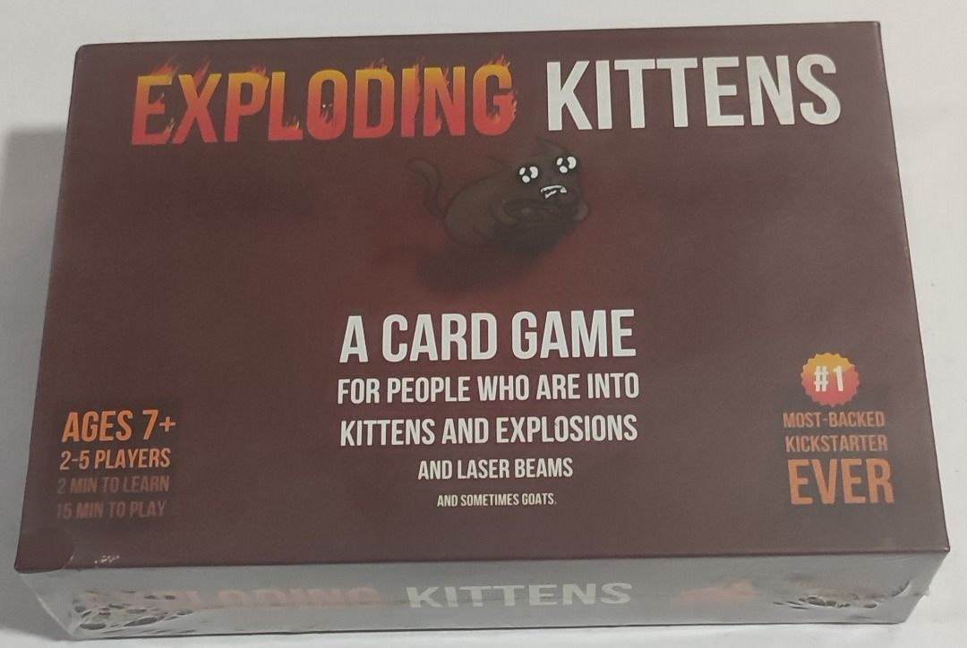 Exploding Kittens (Category: Toys & Games) located in Quezon City. Submitted by boardgamebazaarph (Listing ID 1390828190, Image 1). Description: ** Market Price: $18 (around Php 1,050) ** Class A Exploding Kittens is a kitty-powered version of Russian Roulette. Players take turns drawing cards until someone draws an exploding kitten and loses the game. The deck is made up of cards that let you avoid exploding by peeking at cards before you draw, 