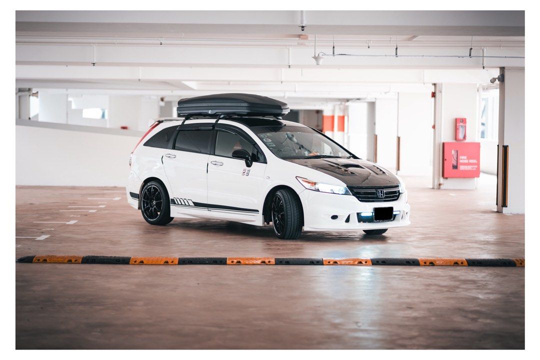 Honda Stream 1.8 (A) (Category: Used Cars) located in Singapore. Submitted by GoodSalesDepartment (Listing ID 1365659368, Image 3). Description: Super Good Condition Honda Stream RN6 with MUGEN Bodykit. Replaced most of the parts. 1) Engine and gearbox gasket all replaced. 2) most Wear and tear all replaced. 3) Engine mounting all replaced. 4) Spark plug all replaced 5) ignition coil replaced. 6) TITAN SP3 coilover (SG selling $2.8k). 7) New IU. 