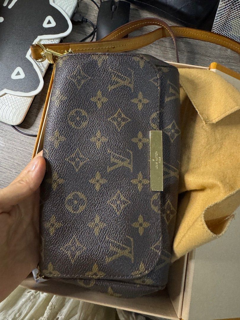 Louis Vuitton Monogram Favorite PM Crossbody (Category: Luxury Bags & Wallets) located in Makati City. Submitted by m_mna (Listing ID 1390874989, Image 1). Description: RankA DIMENSIONS: 9” W x 5” H x 2” D With box, dust bag, long strap and chain.