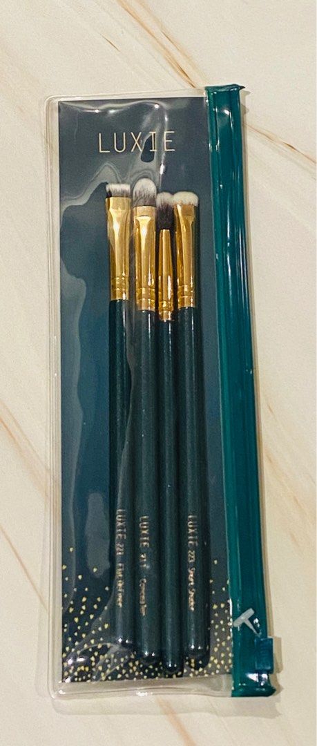 Luxie Enchanted Eyeshadow Eye Brush Set (Category: Makeup) located in Pasay City. Submitted by trendystash (Listing ID 1390935627, Image 2). Description: Luxie Enchanted Eye Set Doll up your eyes using this set of brushes made just for eye-mazing looks. We love that the bristles are incredibly soft but pack a punch. This set includes a concealer brush, flat definer brush, short shader brush, and blending brush. •Includes: 4 brushes - Luxie 221 Fl