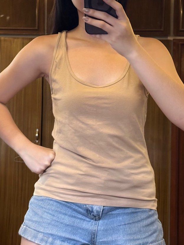 Nude beige sando top (Category: Sleeveless) located in Cainta. Submitted by ree_declutters (Listing ID 1390803144, Image 1). Description: Used once only, too big on me XL on tag Model measurements: Height: 5ft Bust: 30inch / 76cm Waist: 25.5inch / 65cm Hips: 33 inch / 84cm *model has a short torso.