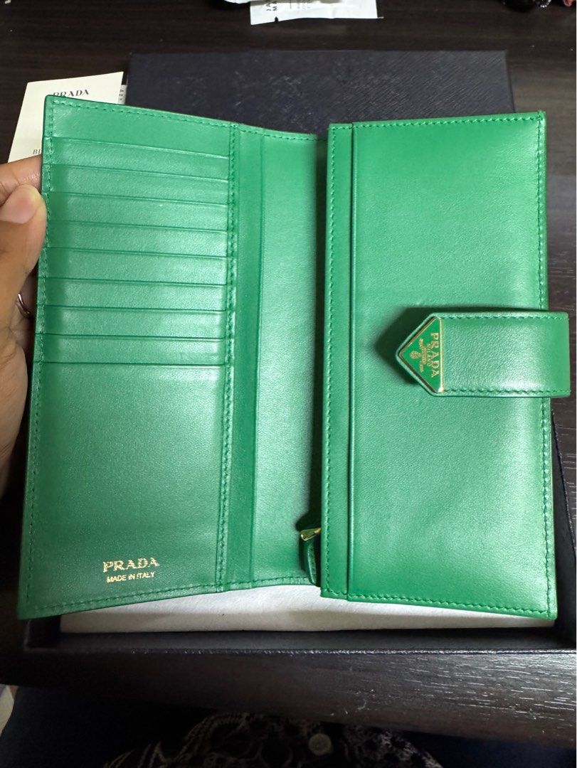 Prada Green Saffiano Wallet (Category: Luxury Bags & Wallets) located in Pasig City. Submitted by extrac (Listing ID 1390850690, Image 3). Description: Purchased in Paris in 2023 (Bottega Green color) With box, cards Used but in good condition See photos for flaws .