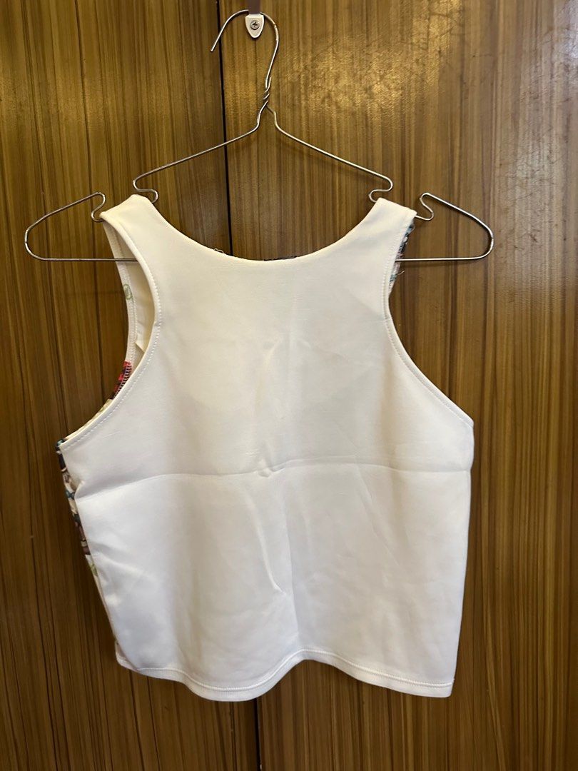 Printed white crop top (Category: Sleeveless) located in Cainta. Submitted by ree_declutters (Listing ID 1390803945, Image 3). Description: Owl printed white crop top Model measurements: Height: 5ft Bust: 30inch / 76cm Waist: 25.5inch / 65cm Hips: 33 inch / 84cm *model has a short torso.