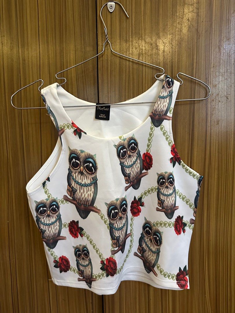 Printed white crop top (Category: Sleeveless) located in Cainta. Submitted by ree_declutters (Listing ID 1390803945, Image 2). Description: Owl printed white crop top Model measurements: Height: 5ft Bust: 30inch / 76cm Waist: 25.5inch / 65cm Hips: 33 inch / 84cm *model has a short torso.