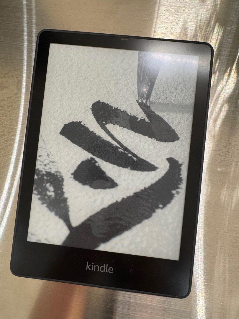 Amazon Kindle E-reader (Category: E-Readers) located in Singapore. Submitted by nespresso31 (Listing ID 1391111210, Image 2). Description: - Amazon Kindle e-reader - Good condition; barely used - Perfect for reading on the go - Clear and easy-to-read screen - Features the Amazon logo on the back.