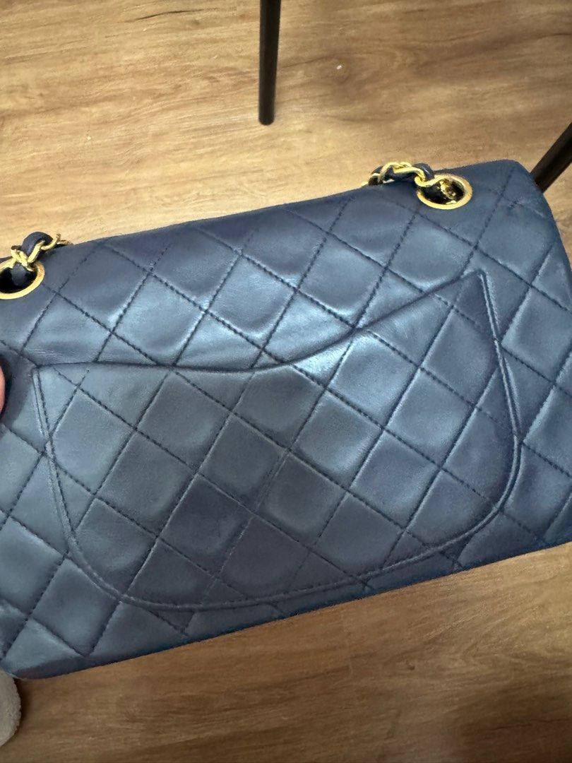 Authentic Chanel Classic Flap small in navy blue (Category: Luxury Bags & Wallets) located in Quezon City. Submitted by everythingundertherainbow (Listing ID 1390982162, Image 3). Description: Authentic Classic Flap in navy blue color 24k gold Issue: bag has been to the spa to fix the fading color since its already old.
