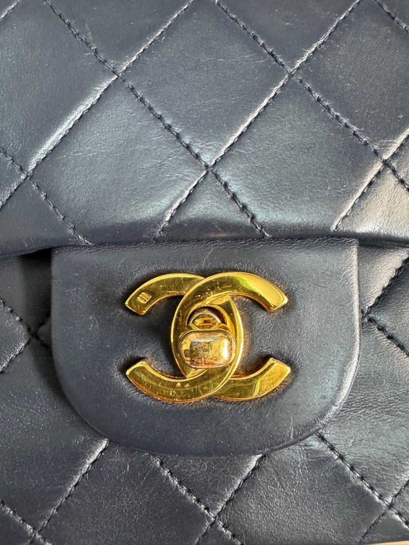 Authentic Chanel Classic Flap small in navy blue (Category: Luxury Bags & Wallets) located in Quezon City. Submitted by everythingundertherainbow (Listing ID 1390982162, Image 2). Description: Authentic Classic Flap in navy blue color 24k gold Issue: bag has been to the spa to fix the fading color since its already old.