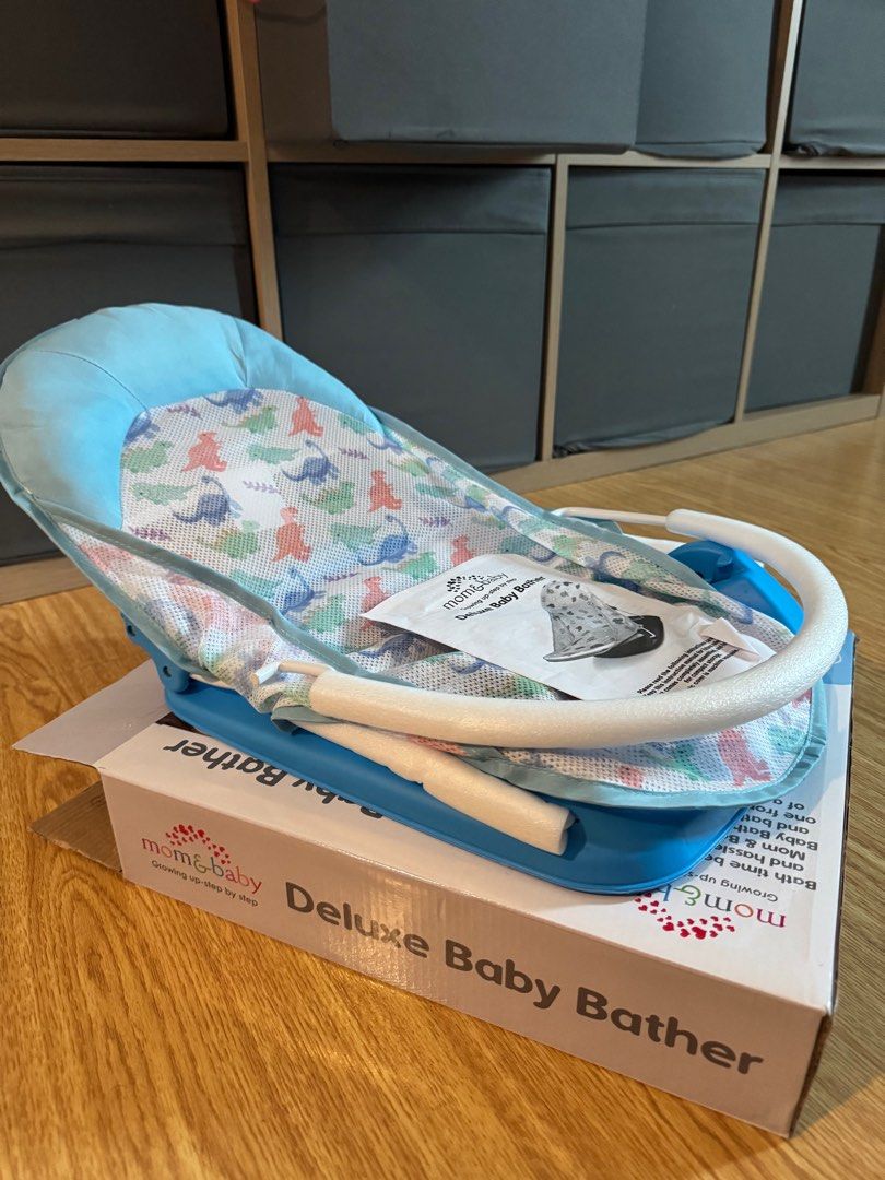 Baby Bather (Category: Bathtub & Bath Accessories) located in Mandaluyong City. Submitted by cris333 (Listing ID 1391041960, Image 2). Description: Mom and Baby Deluxe Baby Bather Dino design Opened box unused .