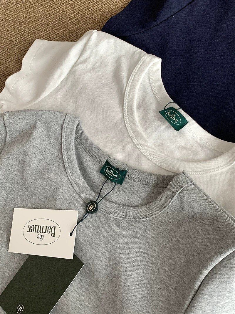 basic tee (Category: Shirts) located in Singapore. Submitted by phhhyyyy (Listing ID 1391017507, Image 2). Description: washed not worn exact to pic, white and grey available one for $7, 2 for $12 .