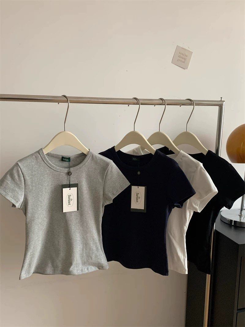 basic tee (Category: Shirts) located in Singapore. Submitted by phhhyyyy (Listing ID 1391017507, Image 1). Description: washed not worn exact to pic, white and grey available one for $7, 2 for $12 .
