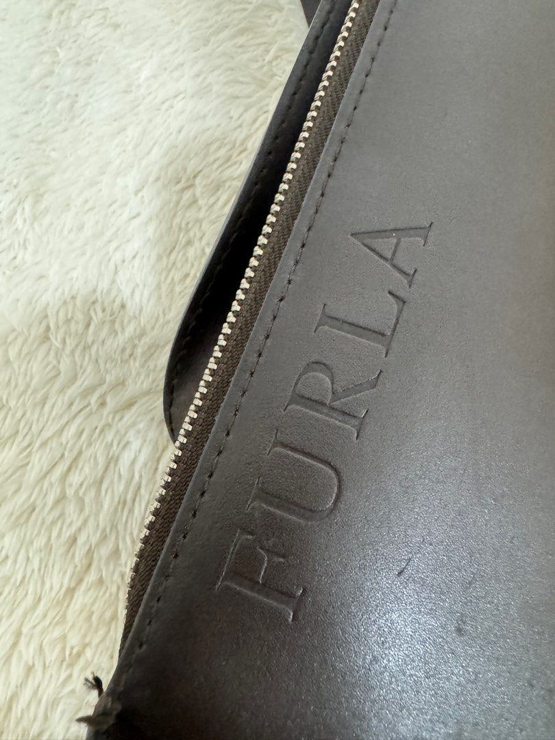 Furla mini leather backpack (Category: Luxury Bags & Wallets) located in Pasig City. Submitted by joyshares (Listing ID 1391056059, Image 3). Description: Decluttering - selling some of my pre-loved bags ❤️ Authentic Furla dark brown mini backpack *with minor sign of usage (see photos) Bought in Japan .