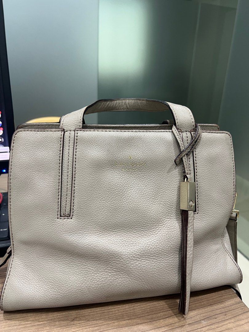 KATE SPADE SATCHEL DOMINIQUE GRAY (Category: Luxury Bags & Wallets) located in Navotas City. Submitted by declutteringstuff_ph (Listing ID 1391137488, Image 1). Description: Original Kate Spade Pebbled Leather 2-way bag in Dominique Gray. The bag has a minor issue and needs cleaning inside. .