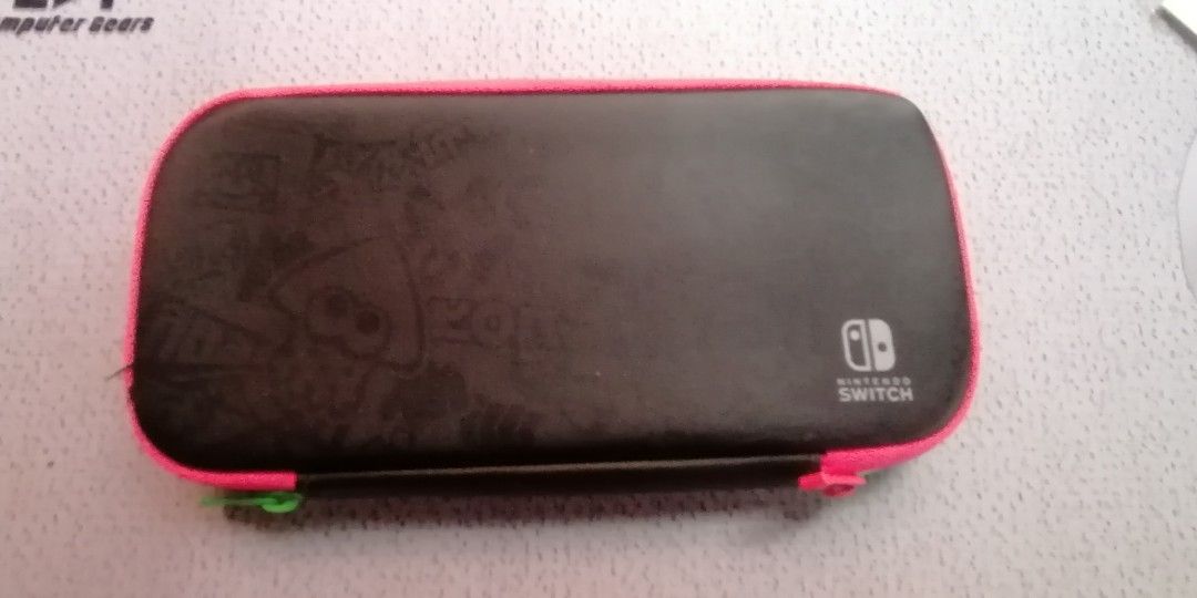 Nintendo Switch Carrying Case Splatoon 2 Edition (Category: Cases & Covers) located in San Jose del Monte. Submitted by r33s3 (Listing ID 1390992102, Image 2). Description: This is a Nintendo Switch Carrying Case, specifically a Splatoon 2 Edition. Features: It includes a carrying case with a Splatoon 2 designed to protect the console from dirt and scratches. Storage: The case has an inner pocket that can hold the console, up to 8 game cards, and
